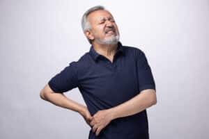Man experiencing back pain.